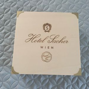 Wooden box branded with the famous Sacher Hotel in Vienna, Austria.